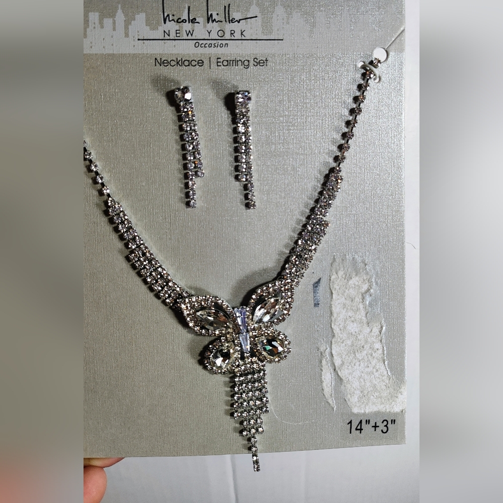 Nicole Miller Silver Crystal Necklace with Buterflie Design.